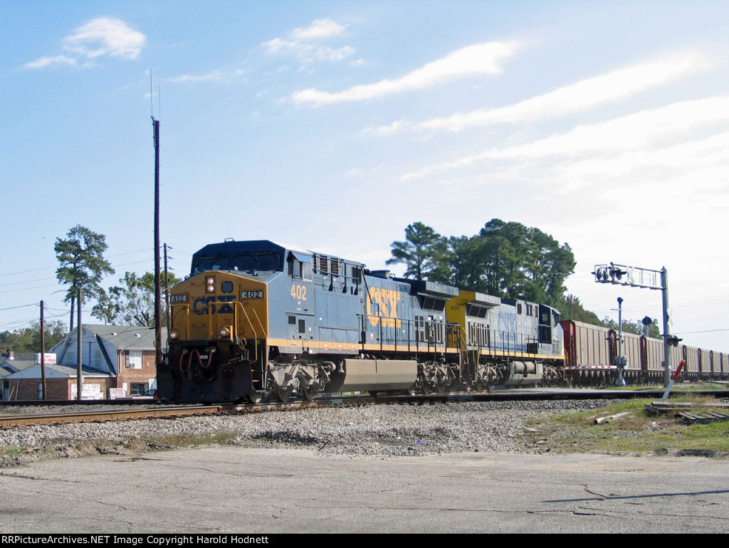 CSX 402 & 431 lead an empty coal train across the diamonds